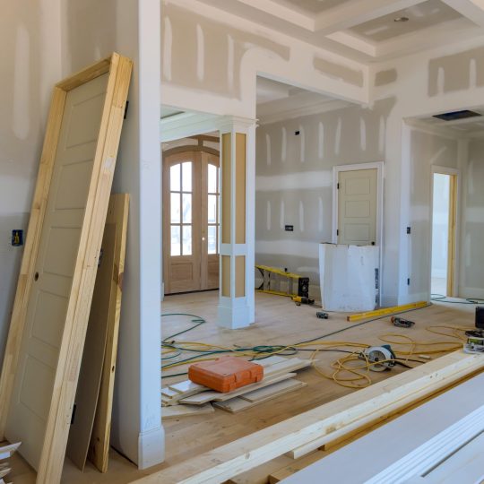 New house under construction with on stacker wooden material door molding trim